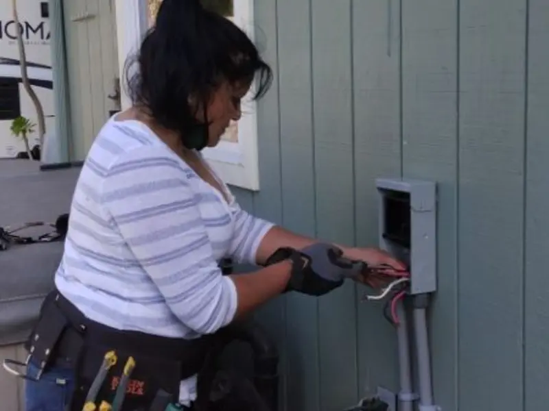 Licensed electrician wiring an exterior subpanel in Palermo