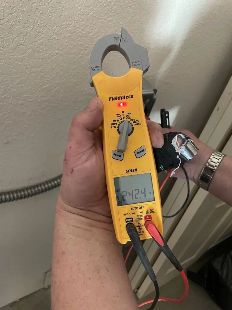 Voltage testing with clamp meter during Electrical Installation Services in Palermo